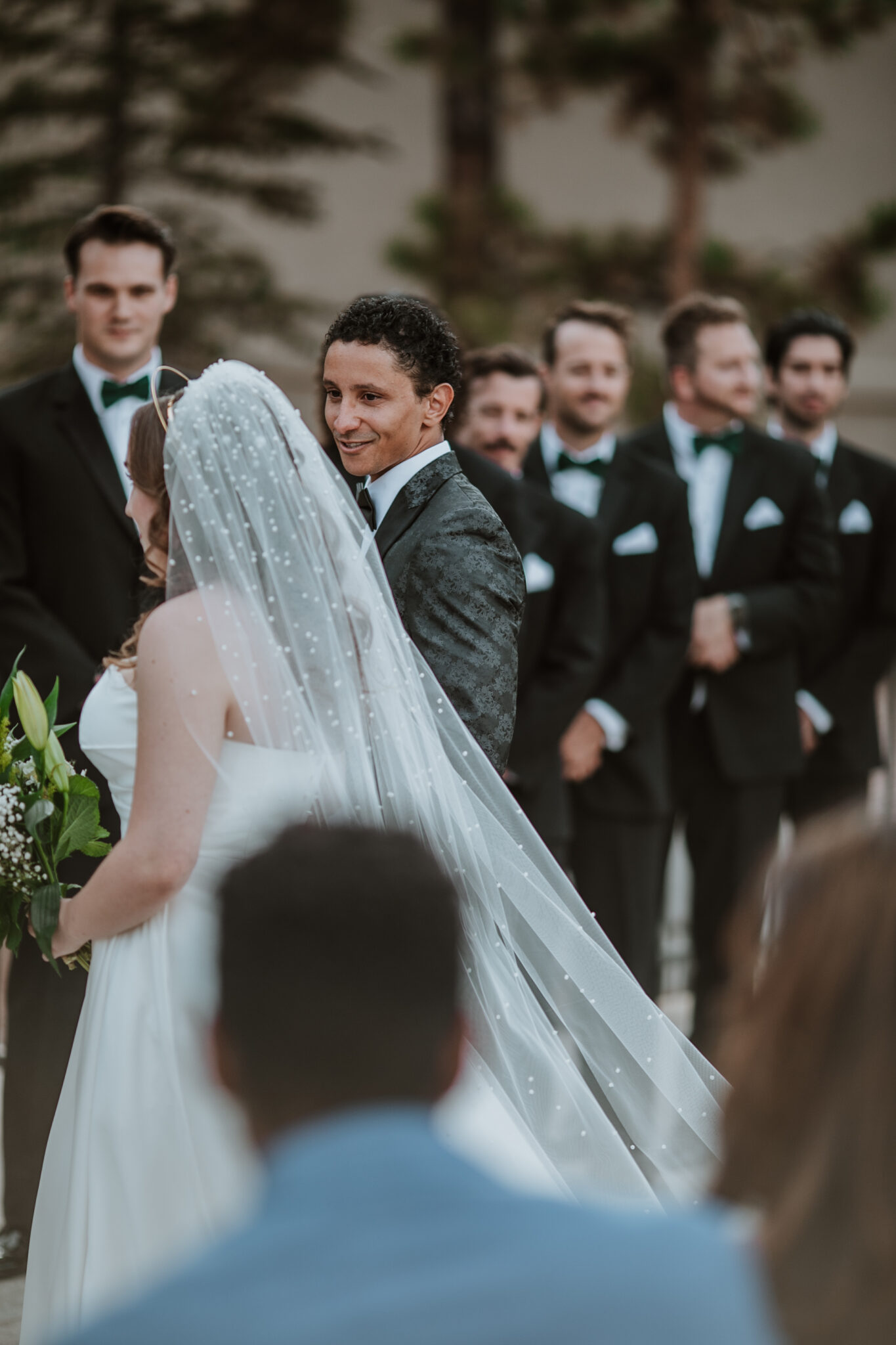 Groom looking at bride at Wedgewood Weddings Black Forest in Colorado Springs