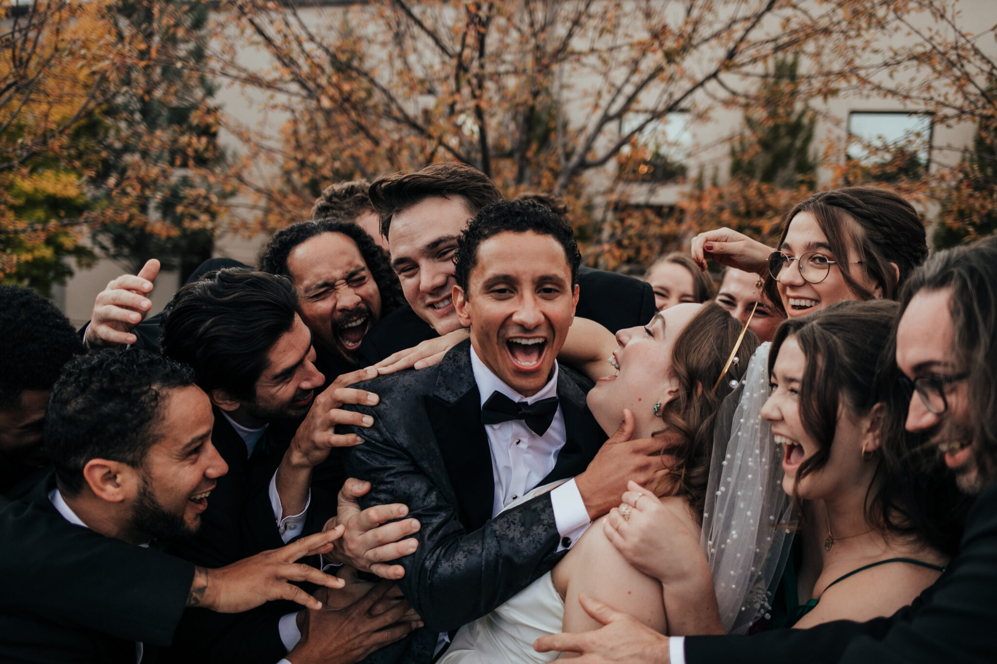 excited and happy groom and wedding party colorado