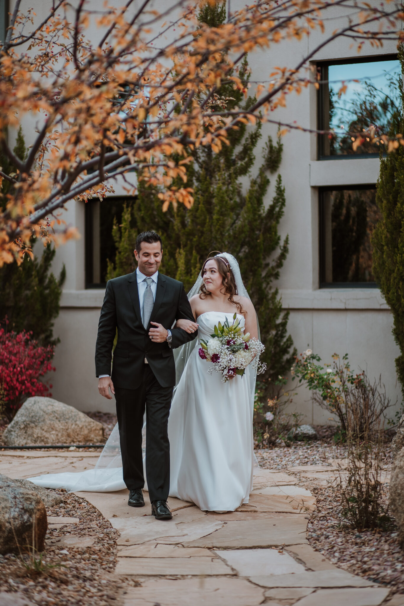 Dad walking bride down the asile wedgewood weddings black forest colorado