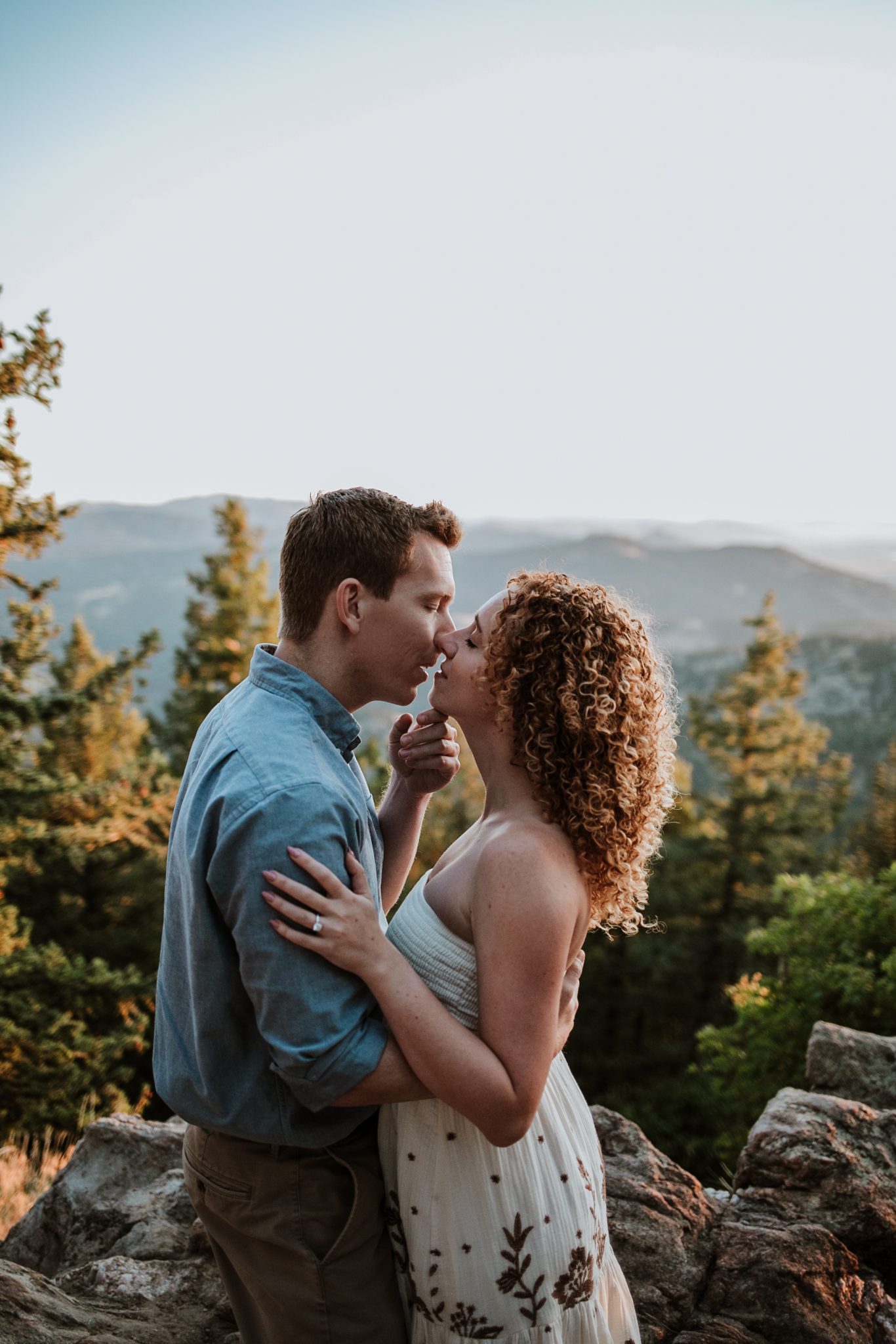 Boulder engagement photographer capturing golden sunrise