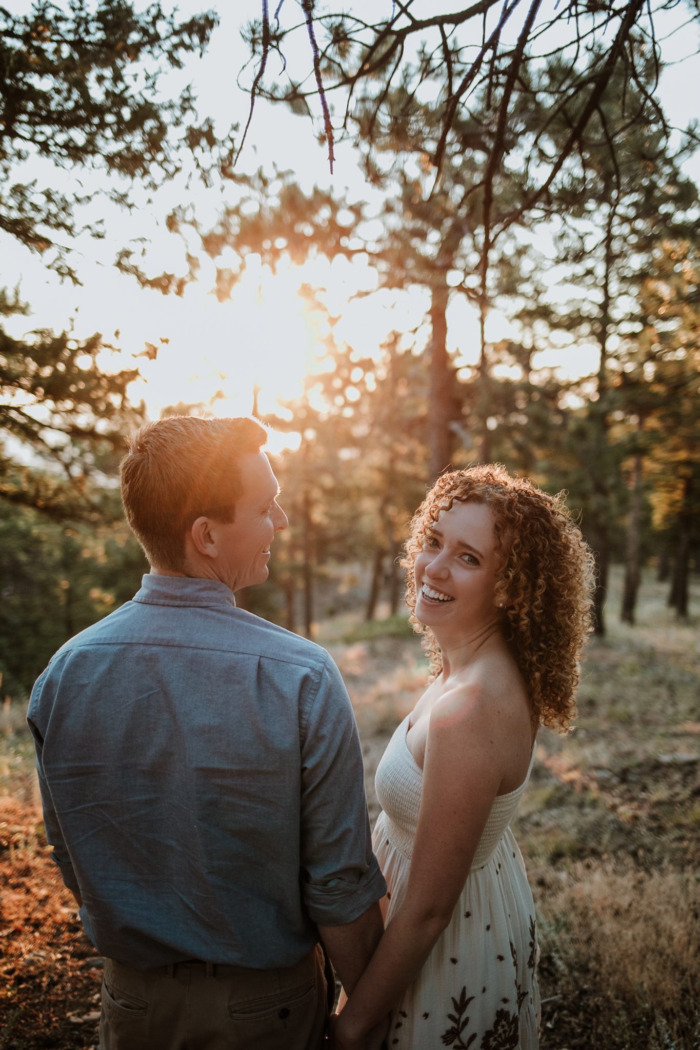 Boulder engagement photographer capturing golden sunrise