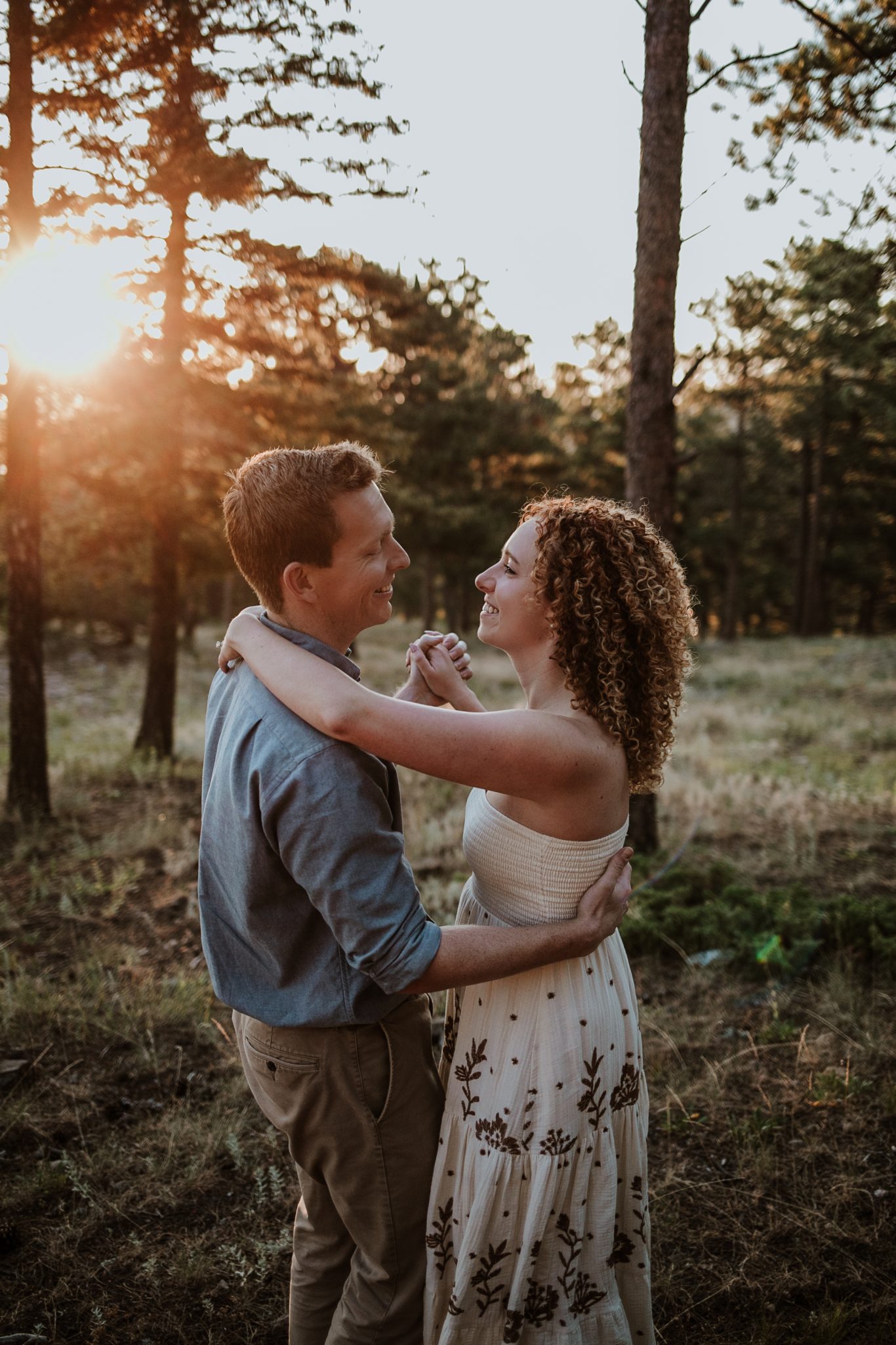 Boulder engagement photographer capturing golden sunrise