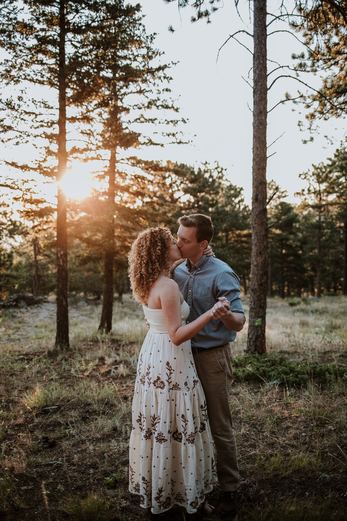 Boulder engagement photographer capturing golden sunrise