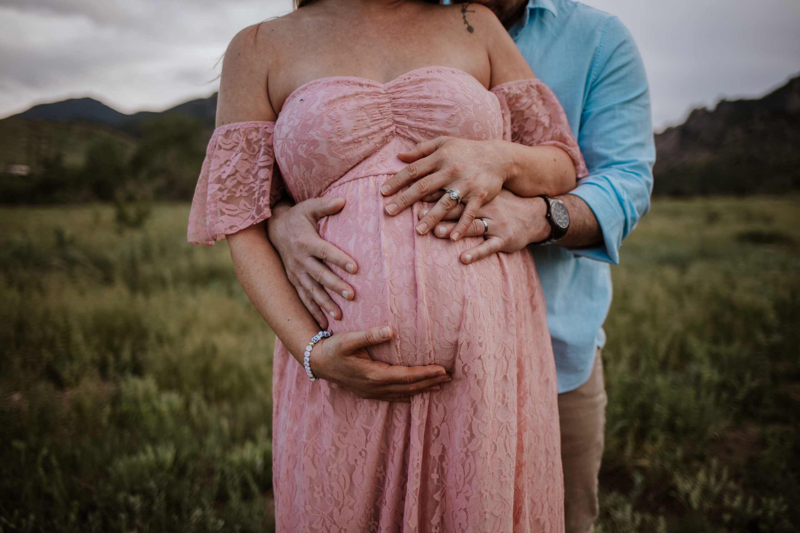 Candid pregnancy photos celebrating Melissa and Jake’s baby girl at South Mesa Trailhead
