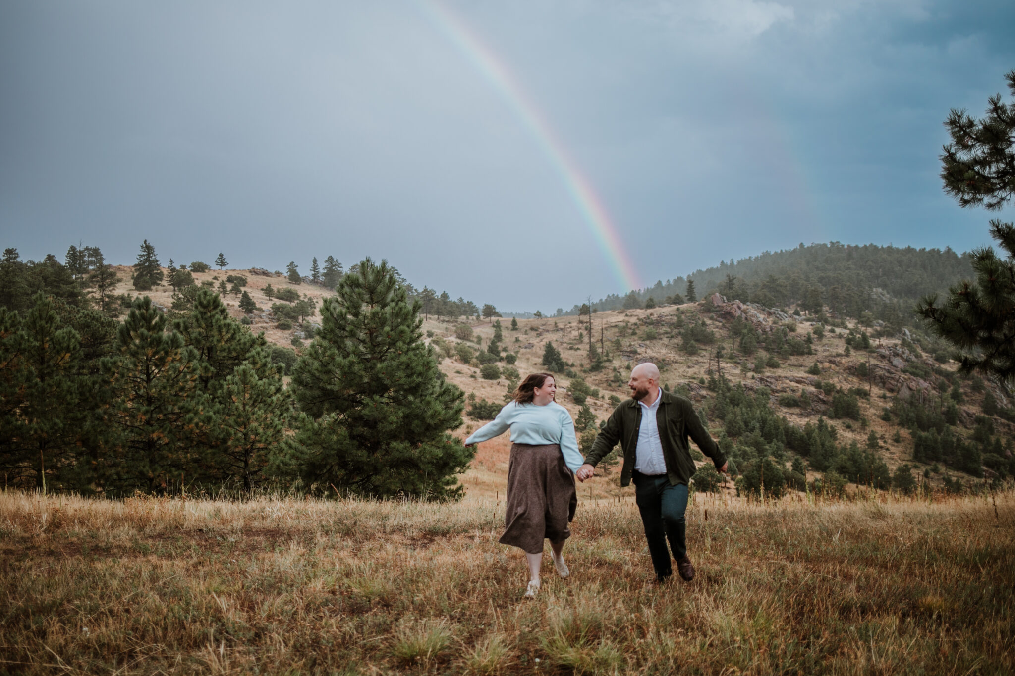rainy rainbow engagement session colorado mountains mount falcon photography
