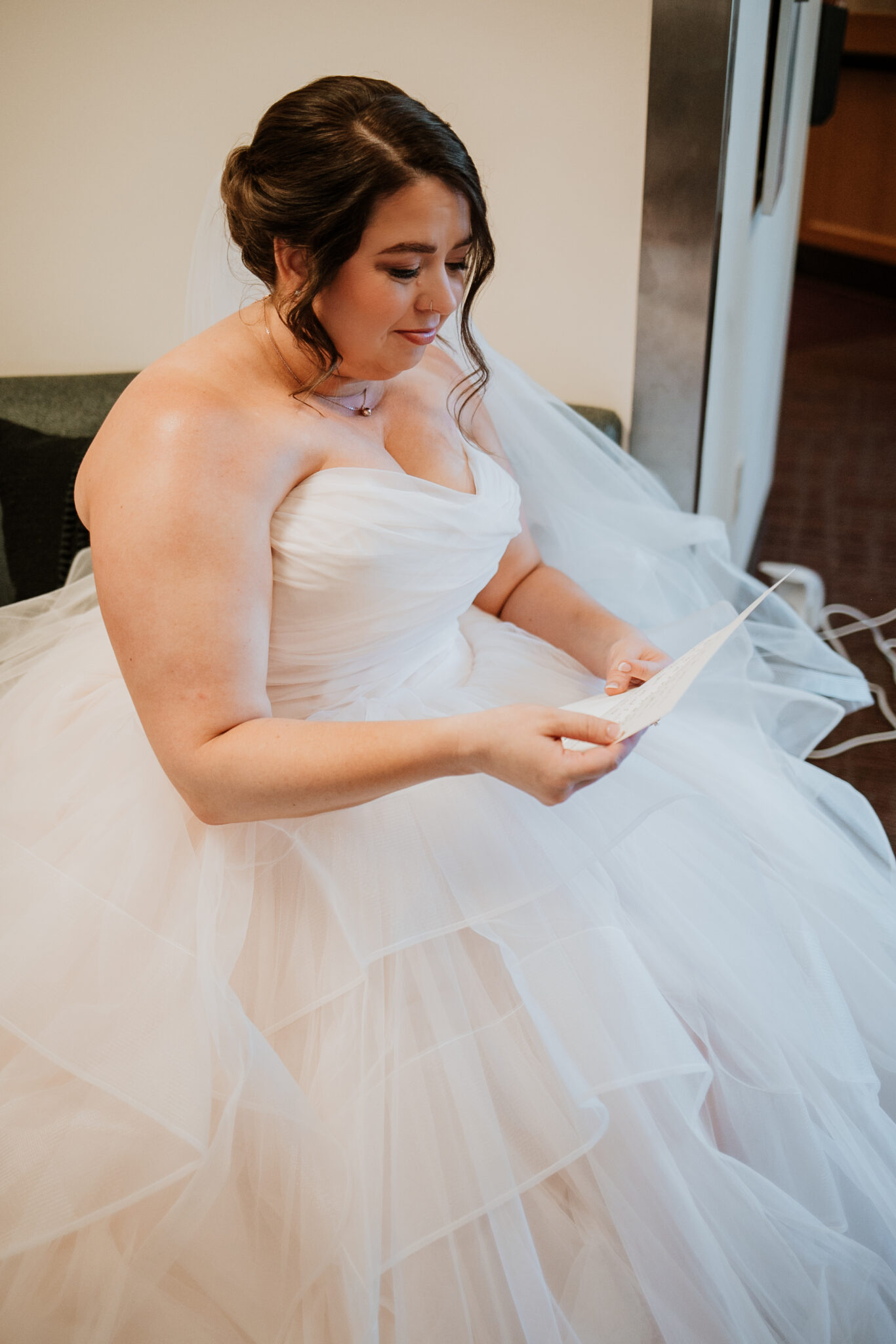 bride reading emotional letter from groom
