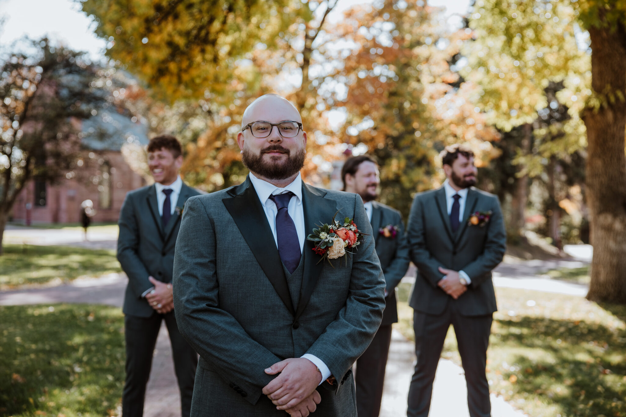 fall photos outdoor at du campus of groom and groomsmen
