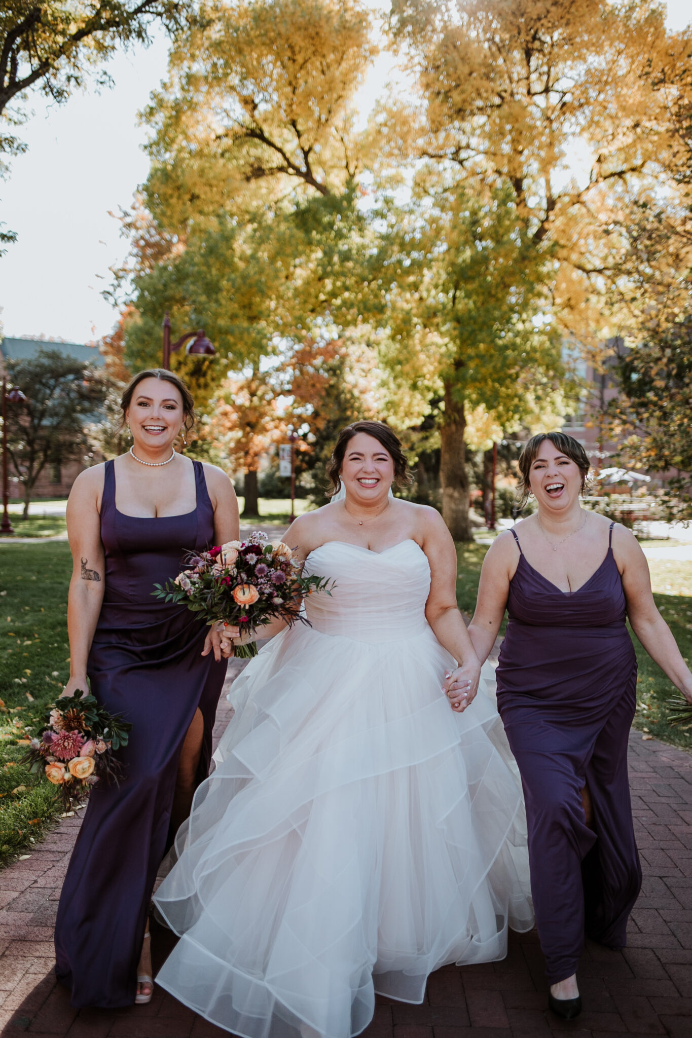 wedding party celebrating during fall wedding at DU campus