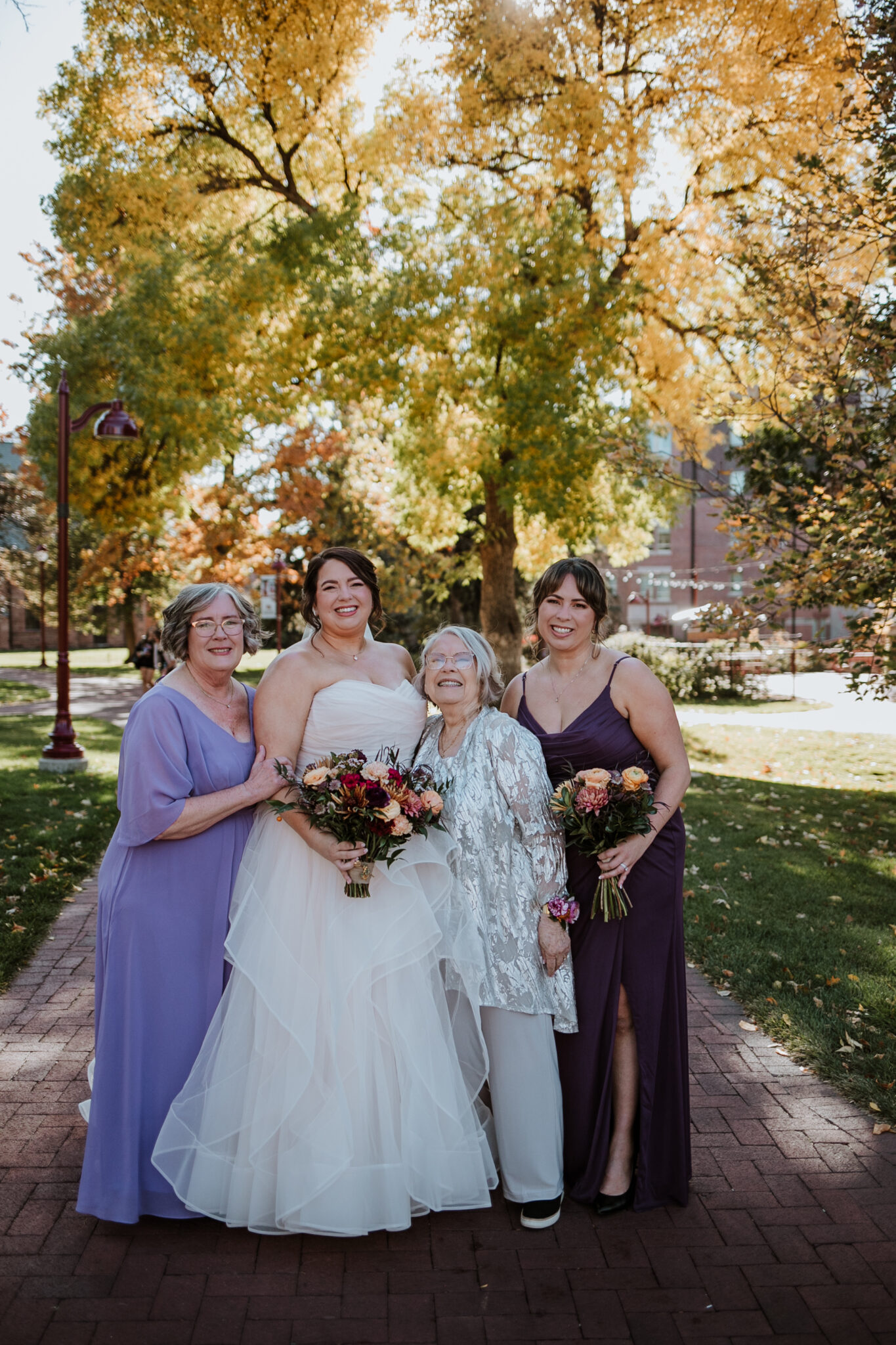 bride and family fall outdoors du wedding photos