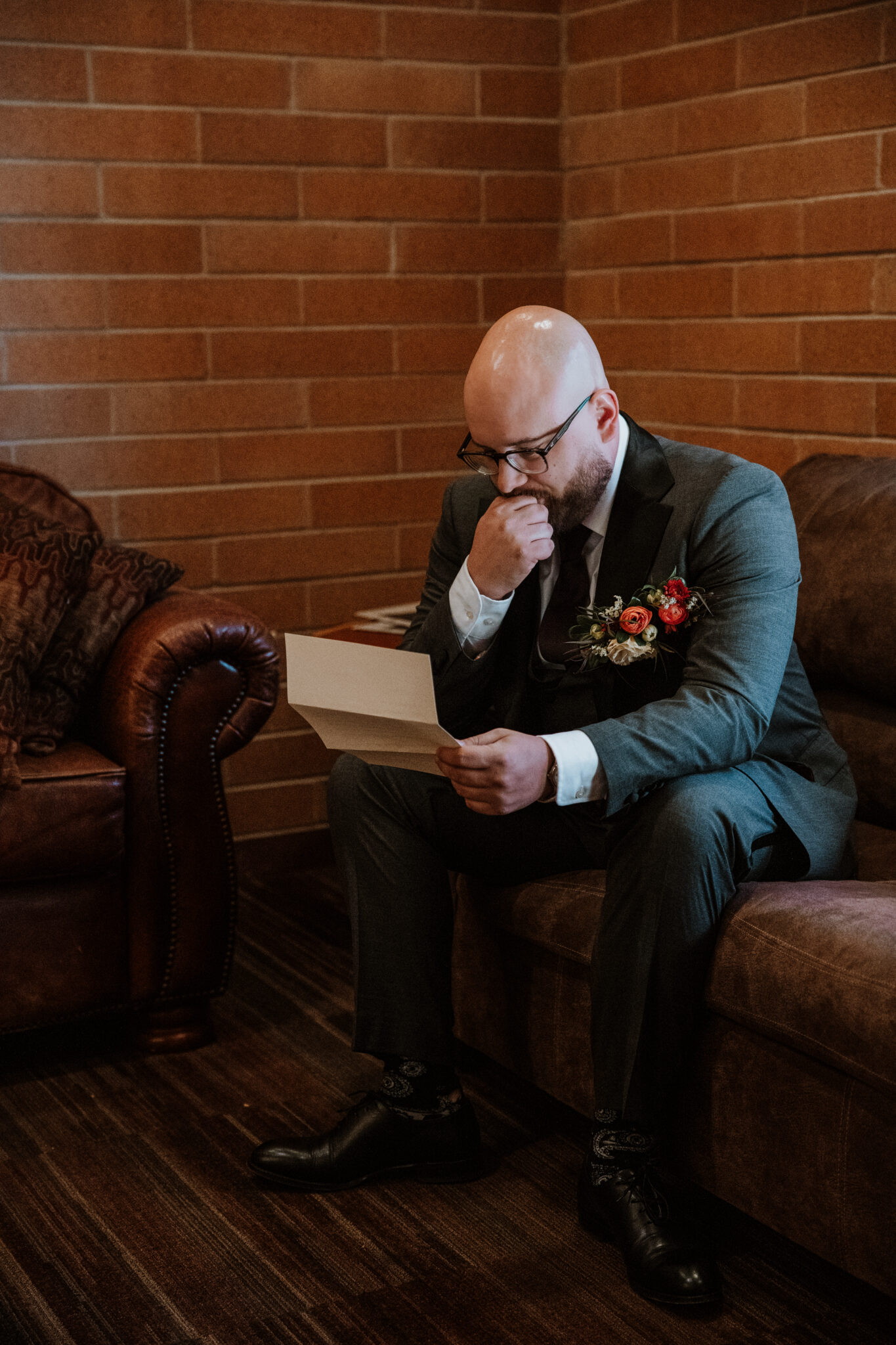 groom reading emotional letter from bride